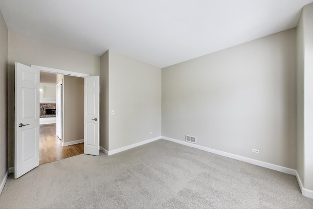 12354 S Blue Water Pkwy, Plainfield, IL 60585 - unfurnished bedroom with carpet floors and a fireplace