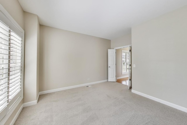 12354 S Blue Water Pkwy, Plainfield, IL 60585 - empty room featuring light carpet and baseboards