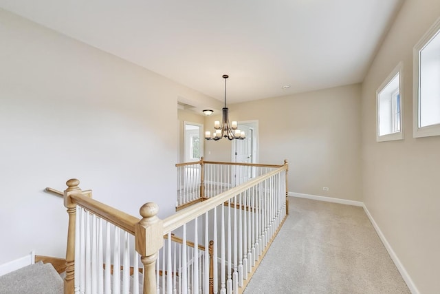 12354 S Blue Water Pkwy, Plainfield, IL 60585 - hall with a chandelier, plenty of natural light, and an upstairs landing