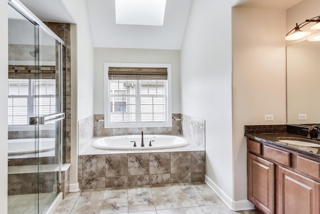 12354 S Blue Water Pkwy, Plainfield, IL 60585 - bathroom featuring vanity, a garden tub, a stall shower, and a skylight