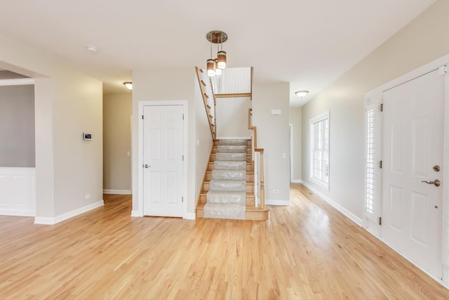 12354 S Blue Water Pkwy, Plainfield, IL 60585 - foyer with light wood-style floors and stairs