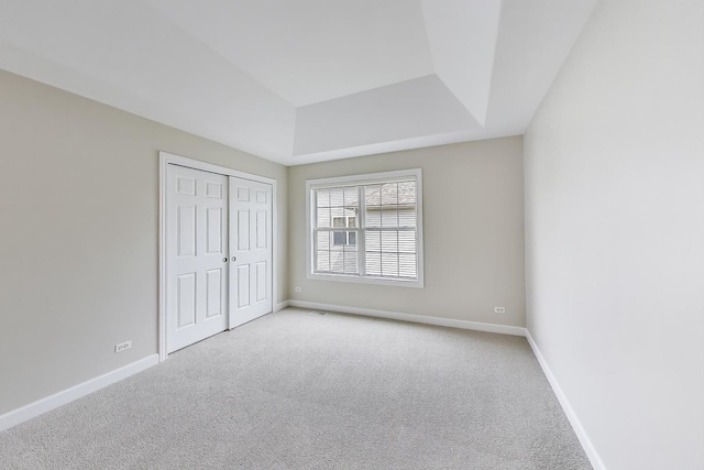12354 S Blue Water Pkwy, Plainfield, IL 60585 - unfurnished bedroom with light colored carpet, a raised ceiling, and a closet