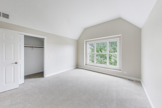 12354 S Blue Water Pkwy, Plainfield, IL 60585 - unfurnished bedroom featuring vaulted ceiling, carpet flooring, and a closet
