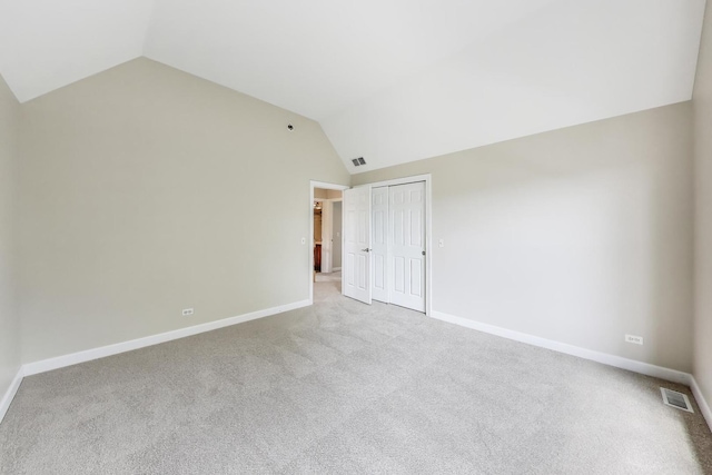 12354 S Blue Water Pkwy, Plainfield, IL 60585 - unfurnished bedroom with vaulted ceiling, carpet flooring, and a closet
