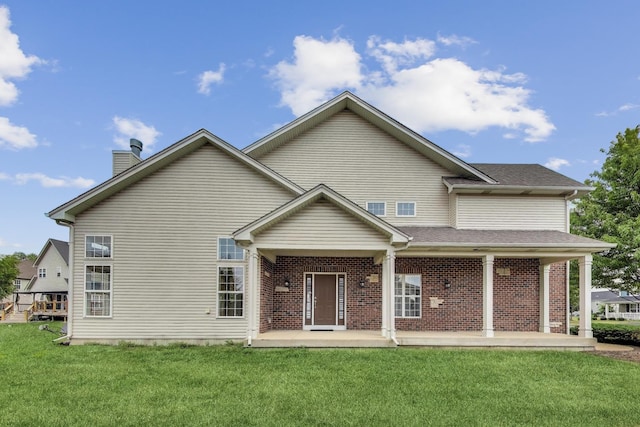 12354 S Blue Water Pkwy, Plainfield, IL 60585 - rear view of property featuring a yard, a chimney, and brick siding