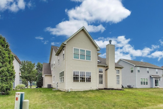 12354 S Blue Water Pkwy, Plainfield, IL 60585 - rear view of property with a yard