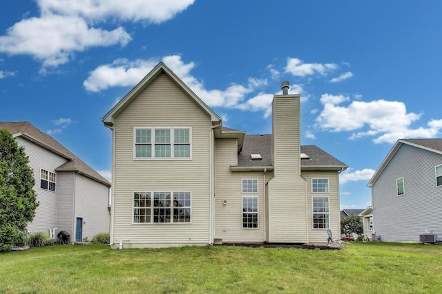 12354 S Blue Water Pkwy, Plainfield, IL 60585 - back of house featuring a chimney and a lawn