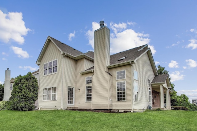 12354 S Blue Water Pkwy, Plainfield, IL 60585 - back of property featuring a chimney, a yard, and a shingled roof