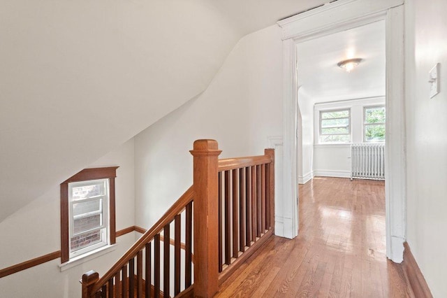 5468 S Ellis Ave, Chicago, IL 60615 - corridor featuring an upstairs landing, radiator heating unit, vaulted ceiling, wood finished floors, and baseboards