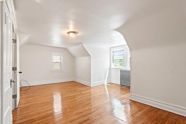 5468 S Ellis Ave, Chicago, IL 60615 - bonus room featuring radiator, vaulted ceiling, light wood-style flooring, and baseboards