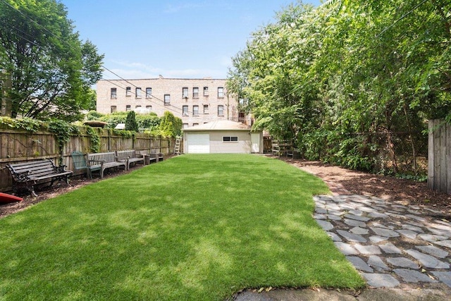 5468 S Ellis Ave, Chicago, IL 60615 - view of yard with a detached garage and an outbuilding