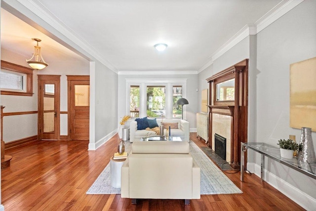 5468 S Ellis Ave, Chicago, IL 60615 - living area featuring a fireplace, wood finished floors, baseboards, and crown molding