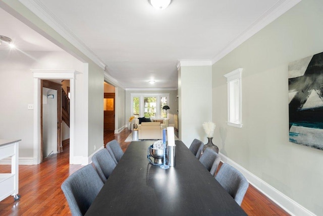 5468 S Ellis Ave, Chicago, IL 60615 - dining area featuring wood finished floors, ornamental molding, and baseboards