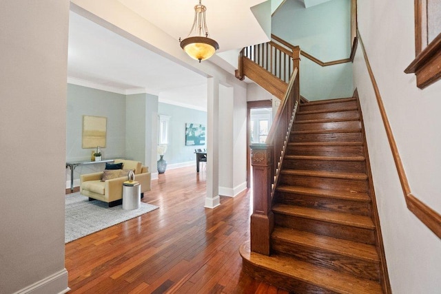 5468 S Ellis Ave, Chicago, IL 60615 - stairs featuring ornamental molding, wood finished floors, and baseboards