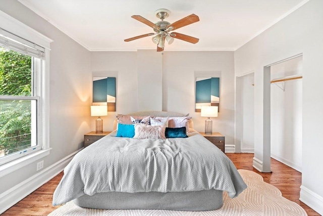 5468 S Ellis Ave, Chicago, IL 60615 - bedroom with wood finished floors, baseboards, crown molding, and ceiling fan