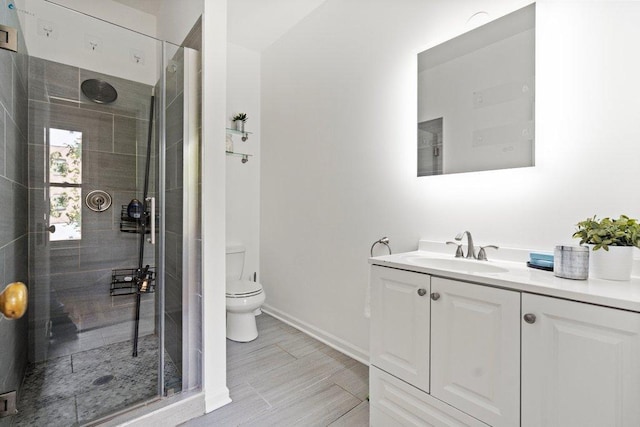 5468 S Ellis Ave, Chicago, IL 60615 - bathroom with vanity, a shower stall, toilet, baseboards, and wood finished floors