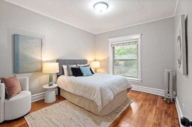 5468 S Ellis Ave, Chicago, IL 60615 - bedroom featuring radiator, wood finished floors, ornamental molding, baseboards, and a baseboard heating unit