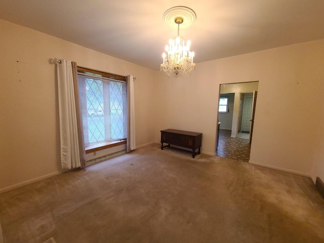 603 7th Ave, Sterling, IL 61081 - carpeted empty room with a chandelier and baseboards