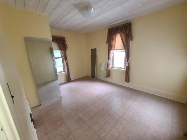 603 7th Ave, Sterling, IL 61081 - empty room with plenty of natural light, wood ceiling, and light floors