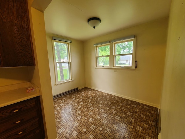 603 7th Ave, Sterling, IL 61081 - unfurnished dining area with baseboards