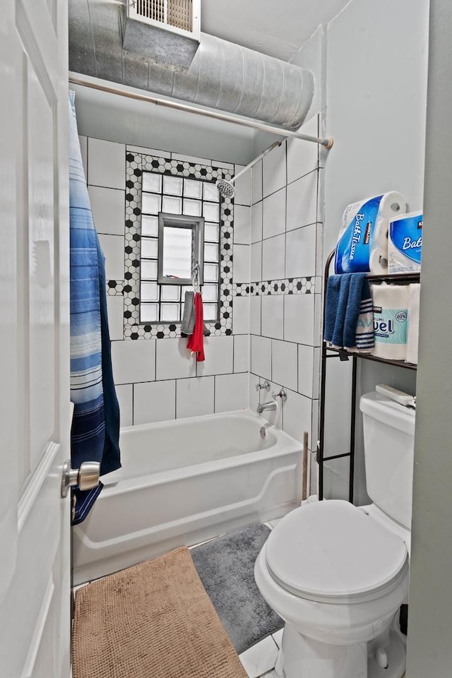 4512 S Fairfield Ave, Chicago, IL 60632 - full bath with shower / bath combo, toilet, and tile patterned floors