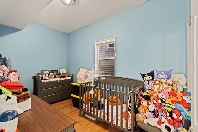 4512 S Fairfield Ave, Chicago, IL 60632 - bedroom featuring wood finished floors and a nursery area