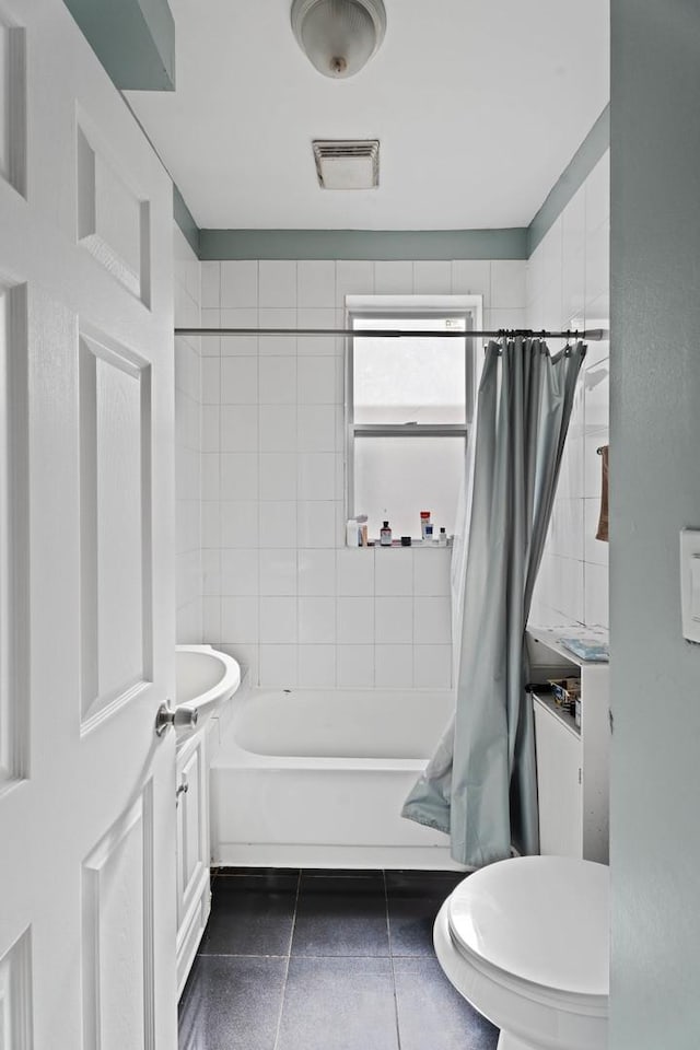 4512 S Fairfield Ave, Chicago, IL 60632 - full bath featuring shower / tub combo, toilet, and tile patterned flooring
