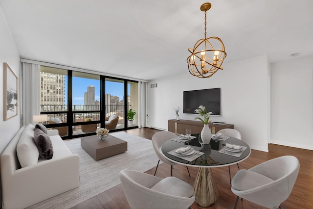 1636 N Wells St Unit 1503, Chicago, IL 60614 - living room featuring a chandelier, wood finished floors, expansive windows, and baseboards