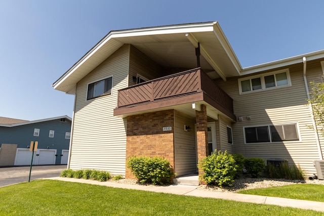 7930 164th Ct Unit 253, Tinley Park, IL 60477 - view of building exterior with central air condition unit and a garage