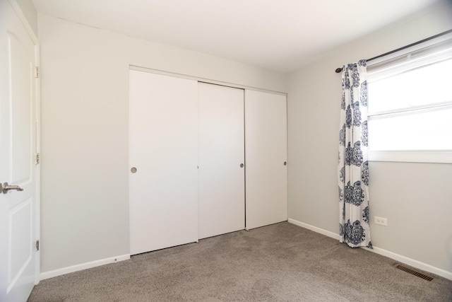 7930 164th Ct Unit 253, Tinley Park, IL 60477 - unfurnished bedroom featuring carpet, a closet, and baseboards