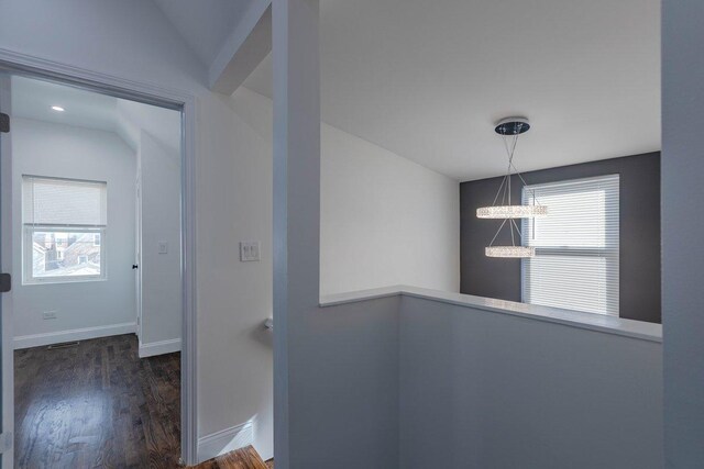 10017 S Indiana Ave, Chicago, IL 60628 - hallway with a chandelier and dark wood-type flooring