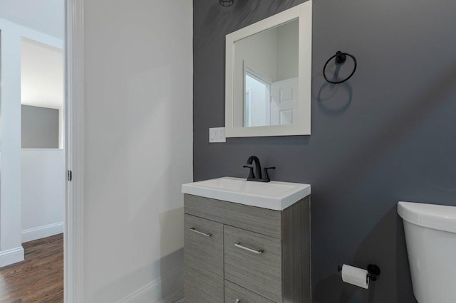 10017 S Indiana Ave, Chicago, IL 60628 - half bath with vanity and wood finished floors