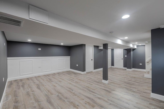 10017 S Indiana Ave, Chicago, IL 60628 - finished below grade area featuring light wood finished floors, recessed lighting, and wainscoting