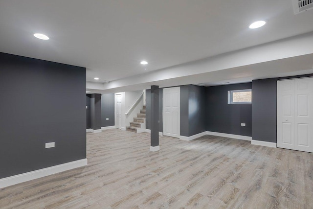 10017 S Indiana Ave, Chicago, IL 60628 - below grade area with light wood finished floors, stairs, and recessed lighting