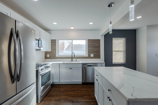 10017 S Indiana Ave, Chicago, IL 60628 - kitchen with stainless steel appliances, tasteful backsplash, light stone counters, dark wood-style floors, and recessed lighting