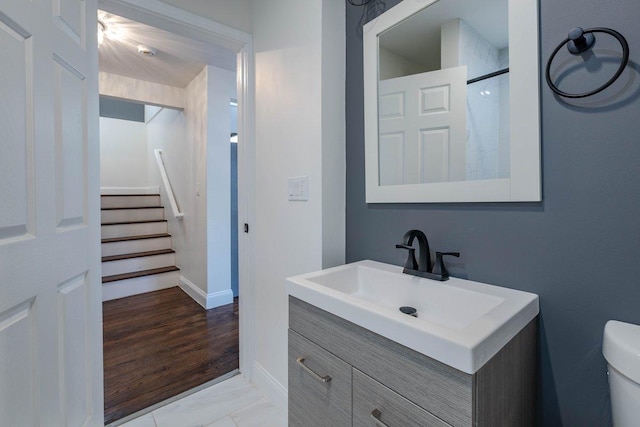10017 S Indiana Ave, Chicago, IL 60628 - bathroom featuring vanity, marble look tile flooring, and a shower