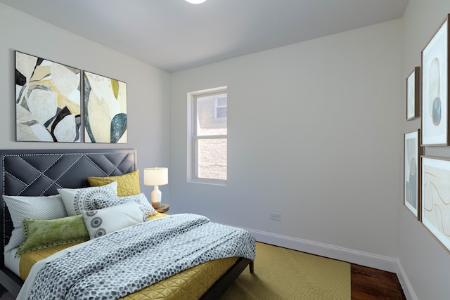 10017 S Indiana Ave, Chicago, IL 60628 - bedroom with baseboards and wood finished floors