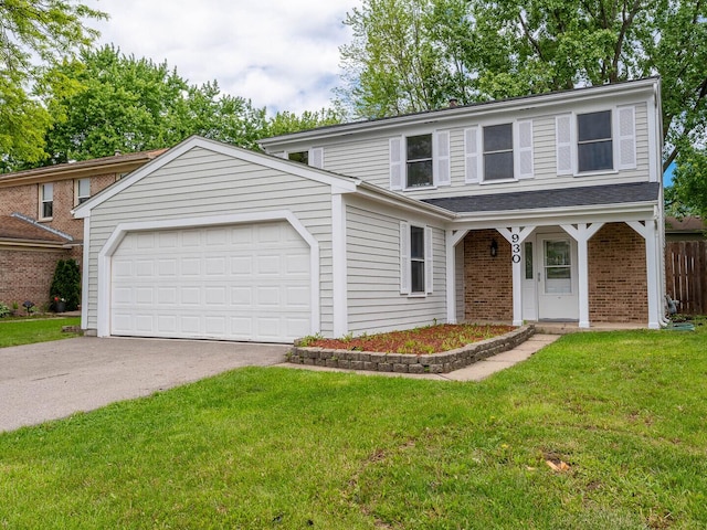 930 W Bryn Mawr Ave, Roselle, IL 60172 - traditional-style home featuring asphalt driveway, an attached garage, a front lawn, and brick siding
