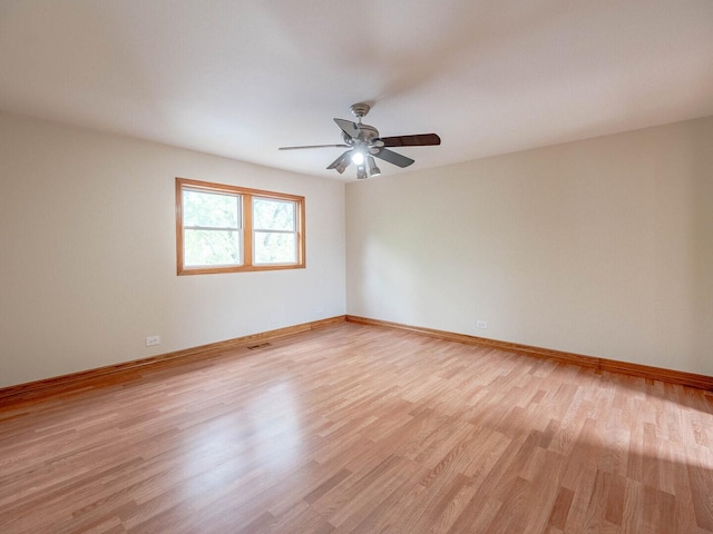 930 W Bryn Mawr Ave, Roselle, IL 60172 - unfurnished room with light wood finished floors, baseboards, and a ceiling fan