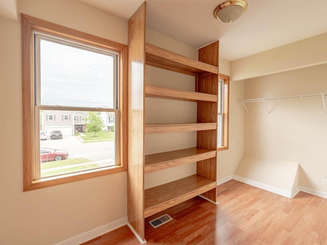 930 W Bryn Mawr Ave, Roselle, IL 60172 - spacious closet featuring wood finished floors