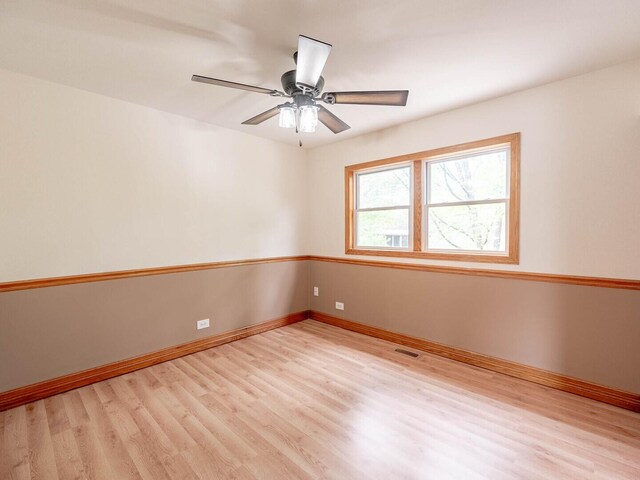930 W Bryn Mawr Ave, Roselle, IL 60172 - empty room featuring light wood-type flooring, baseboards, and ceiling fan
