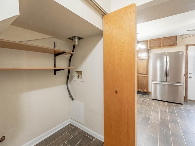 930 W Bryn Mawr Ave, Roselle, IL 60172 - basement featuring freestanding refrigerator, baseboards, and wood finish floors