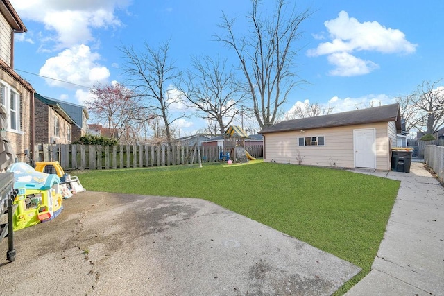 18006 Oakwood Ave, Lansing, IL 60438 - view of yard with a playground, a patio area, and an outbuilding