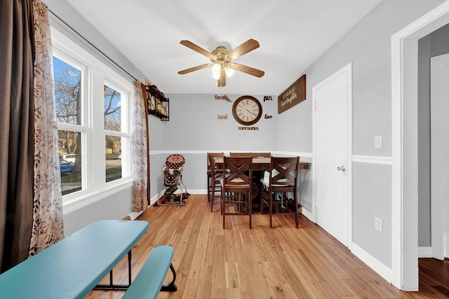 18006 Oakwood Ave, Lansing, IL 60438 - dining area with light wood-style flooring, ceiling fan, and baseboards