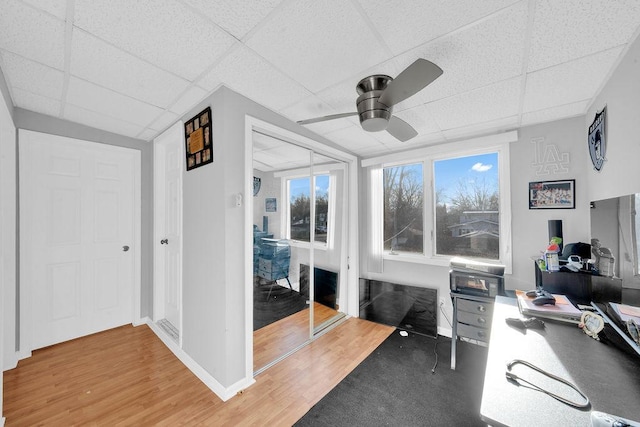 18006 Oakwood Ave, Lansing, IL 60438 - office area with a drop ceiling, a ceiling fan, wood finished floors, and baseboards