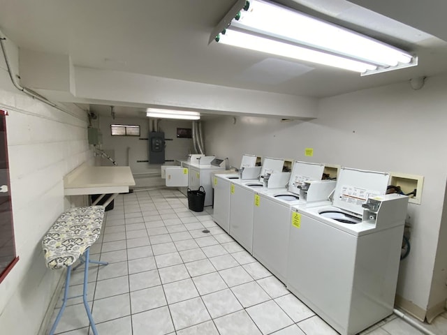 7413 Brookdale Dr Unit 103, Darien, IL 60561 - shared laundry room featuring washing machine and clothes dryer and light tile patterned flooring