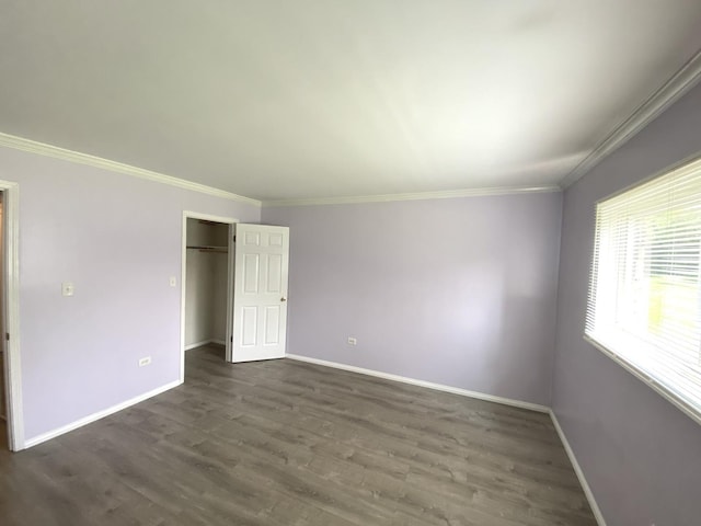 7413 Brookdale Dr Unit 103, Darien, IL 60561 - unfurnished bedroom featuring baseboards, crown molding, dark wood-style floors, and a closet