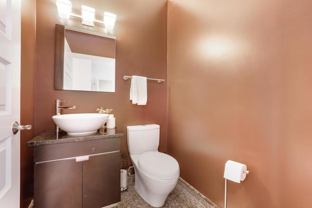 5843 N Oconto Ave, Chicago, IL 60631 - half bathroom with toilet, vanity, and baseboards