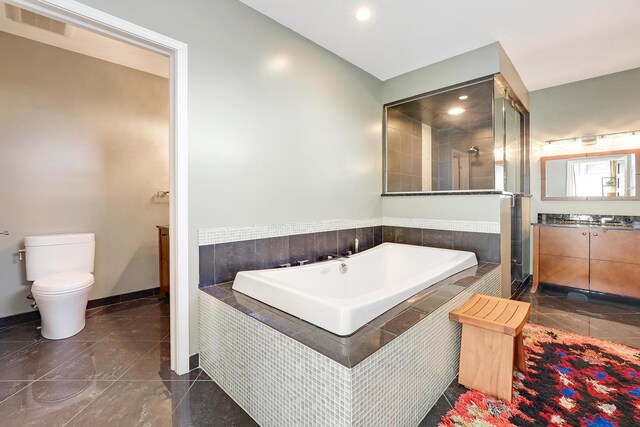 5843 N Oconto Ave, Chicago, IL 60631 - bathroom featuring a shower stall, a garden tub, vanity, toilet, and tile patterned floors