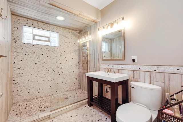 5843 N Oconto Ave, Chicago, IL 60631 - full bath with tiled shower, toilet, tile walls, vanity, and a wainscoted wall